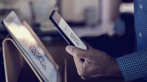 Customer using smart phone to scan QR code